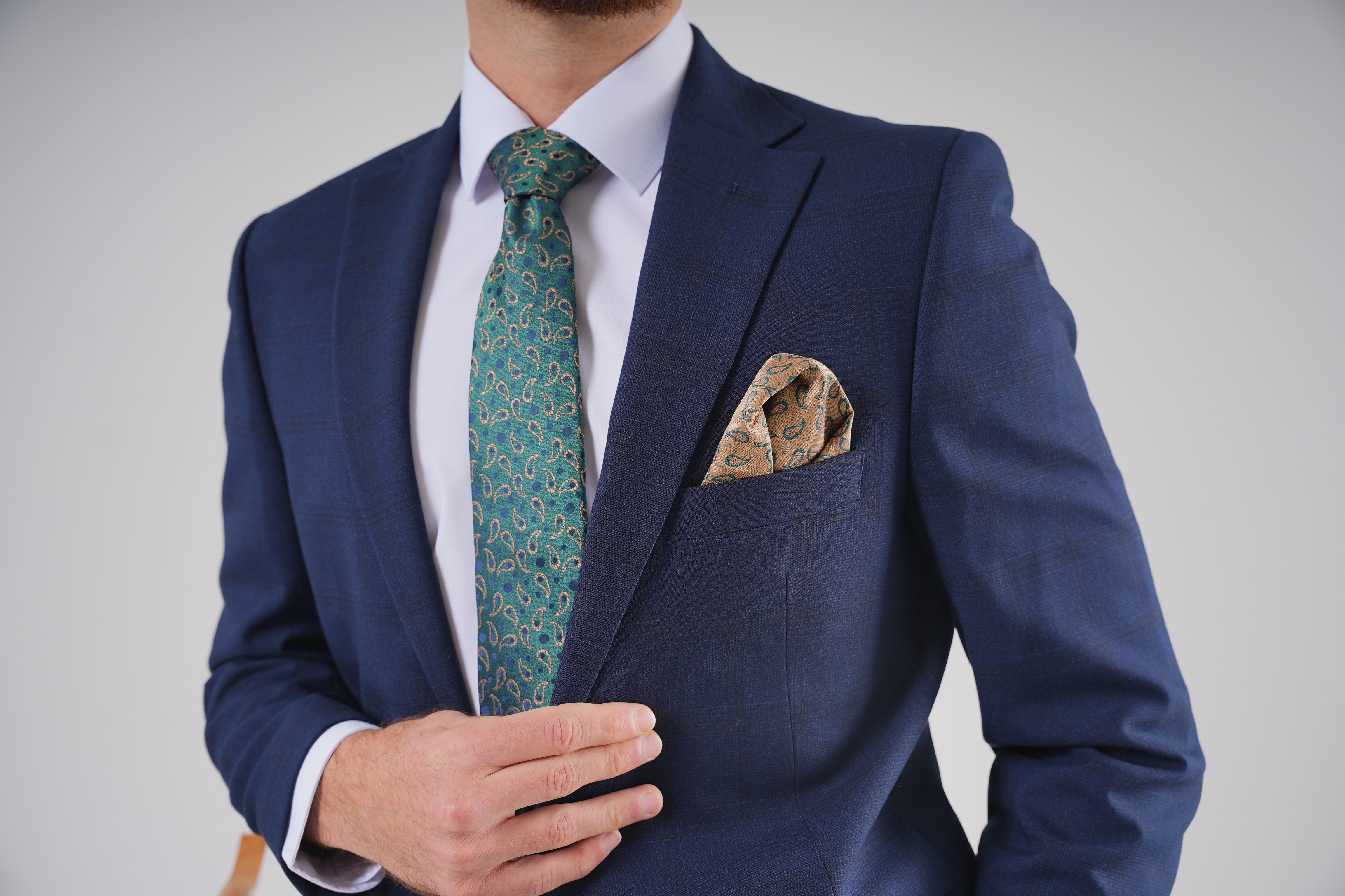 Model wearing a tailored black suit jacket